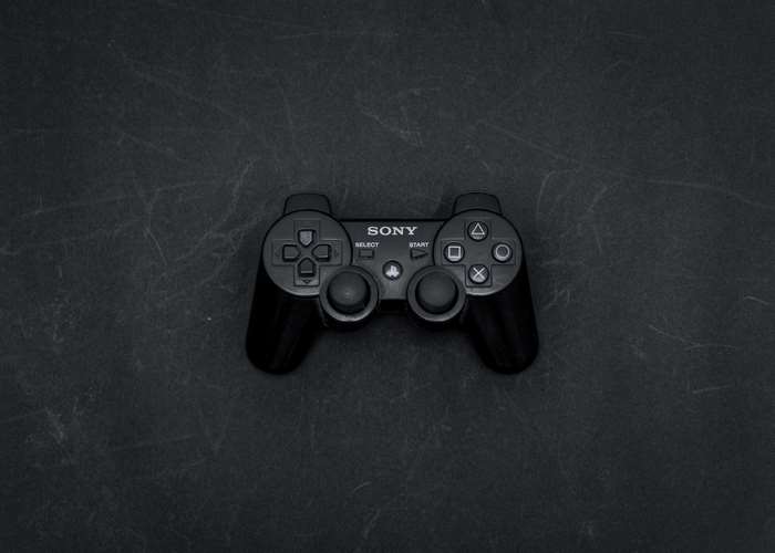 Sony PlayStation controller on a dark surface