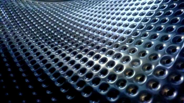 Washing machine drum with perforations