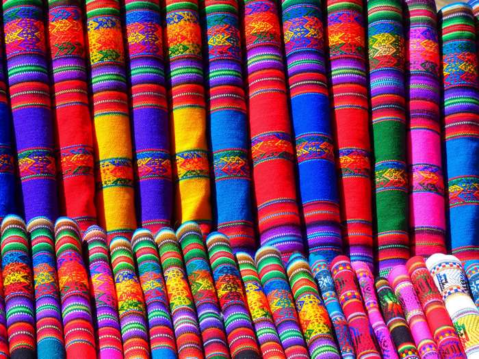 Colorful woven textiles in rows