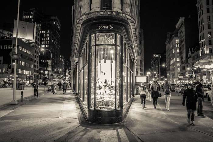 Sprint store on a city street at night