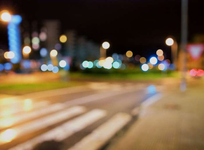 Bokeh city lights at night on a street