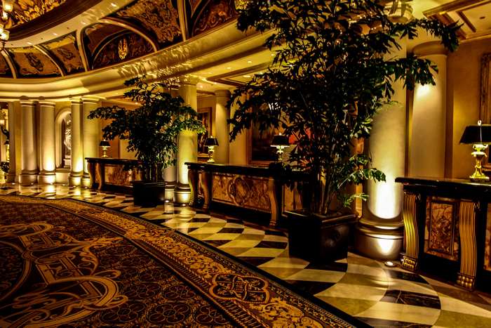 Casino interior with ornate decor and plants