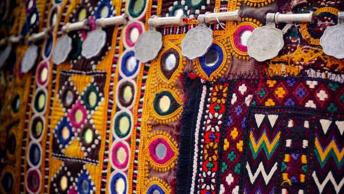Colorful embroidered fabric with mirrors and coins