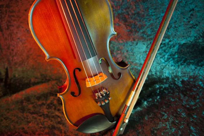 Violin and Bow on Textured Background 4K