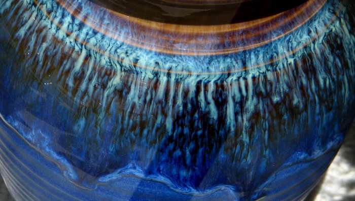 Close-up of blue and brown glazed pottery texture