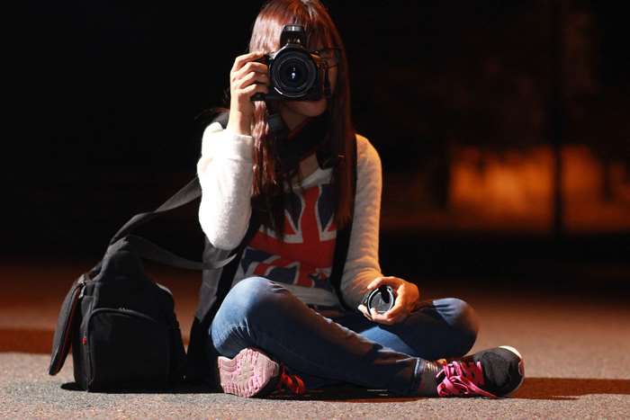 Woman with DSLR camera taking a photo
