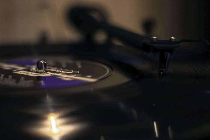 Close-up of a vinyl record player needle on a record