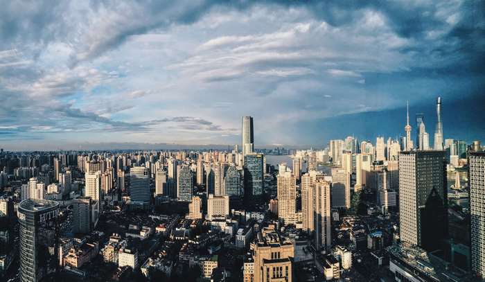 Panoramic Cityscape with Skyscrapers Under Cloudy Sky 4K