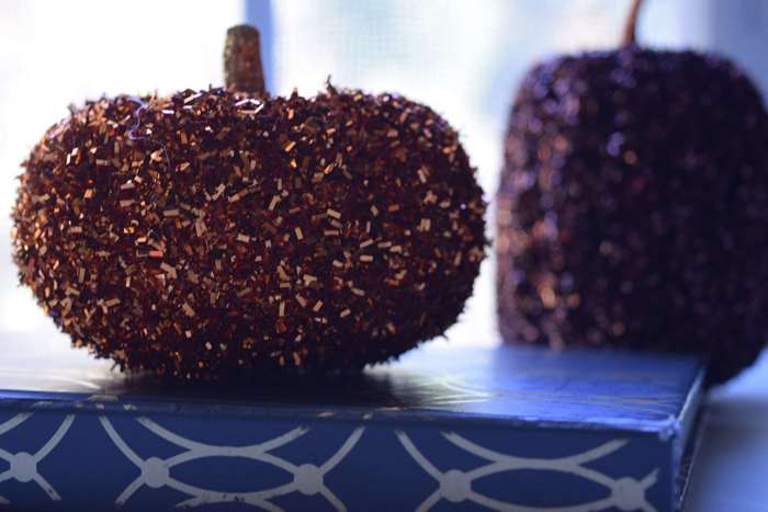 Sparkly pumpkins on a book