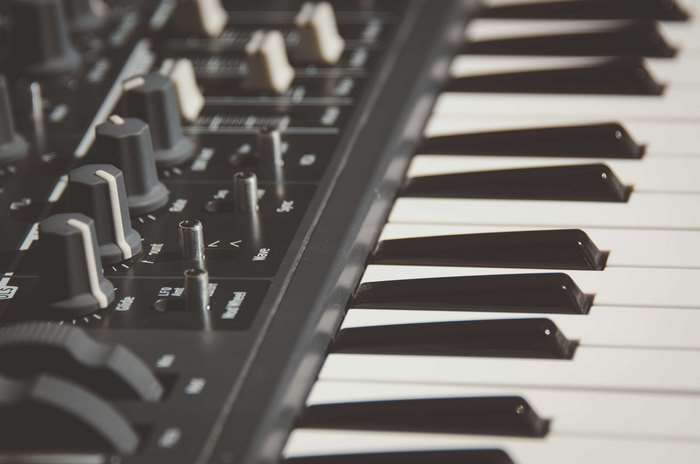 Close-up of a black electronic keyboard with white keys