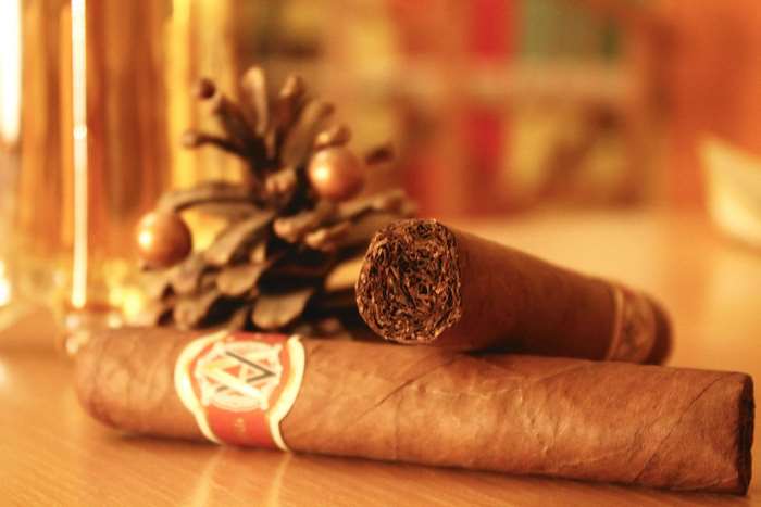 Cigars and pine cone decoration
