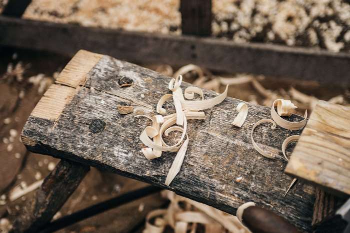 Wood shavings on a weathered workbench