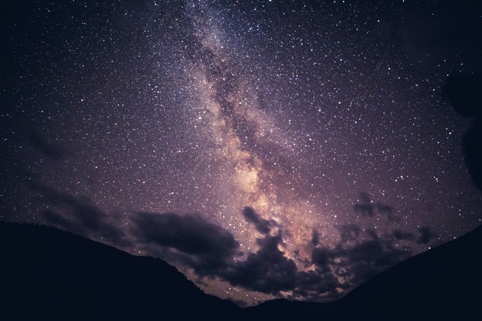 Milky Way galaxy over mountains at night