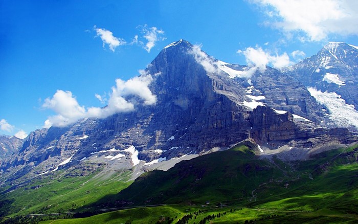 Eiger mountain in the Swiss Alps under a blue sky