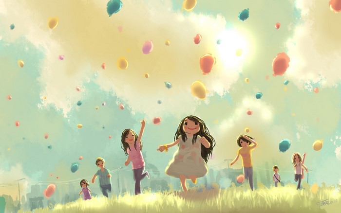 Children running and jumping with balloons in a grassy field
