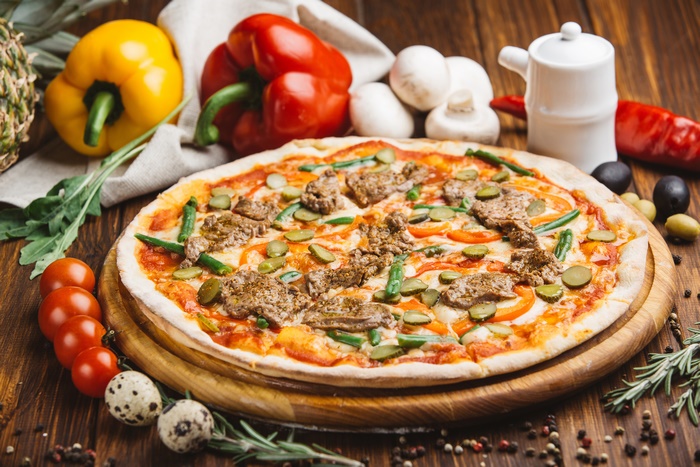 Delicious Gourmet Pizza with Fresh Vegetables and Herbs
