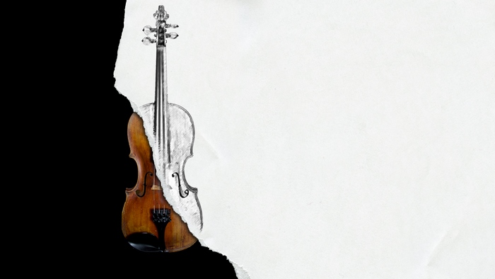 Violin torn between black and white paper