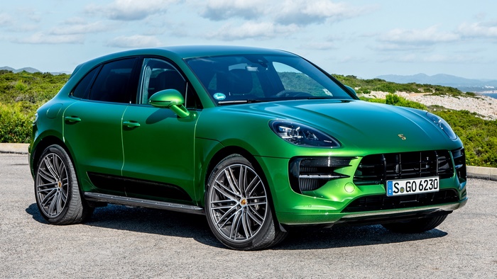 Green Porsche Macan SUV parked outdoors