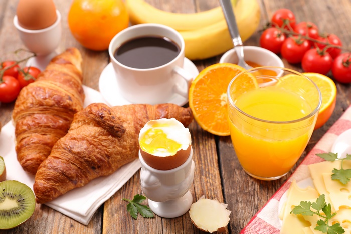 Breakfast with Croissants, Coffee, Juice, and Fruit