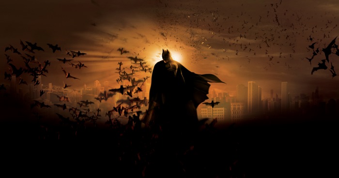 Batman from DC Comics with bats over Gotham City