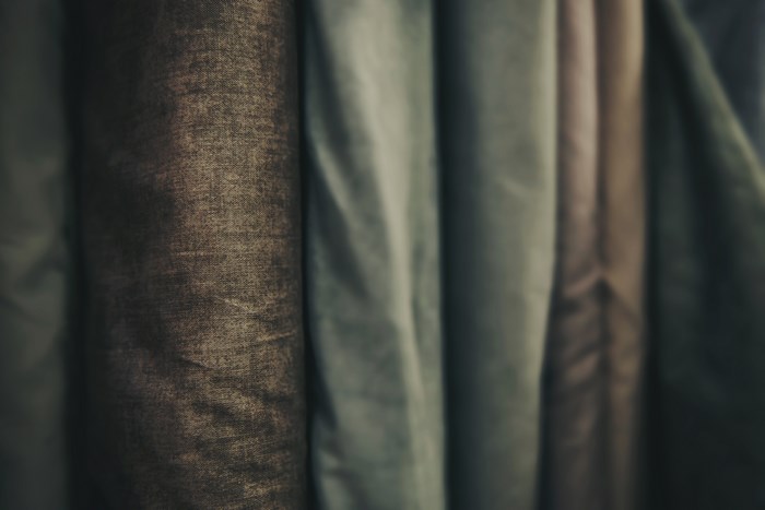 Close-up of rolled fabrics in muted colors