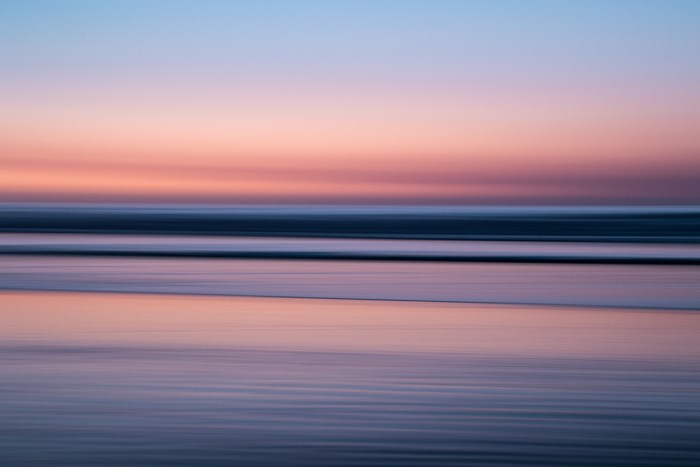 Abstract blur of ocean waves at sunset
