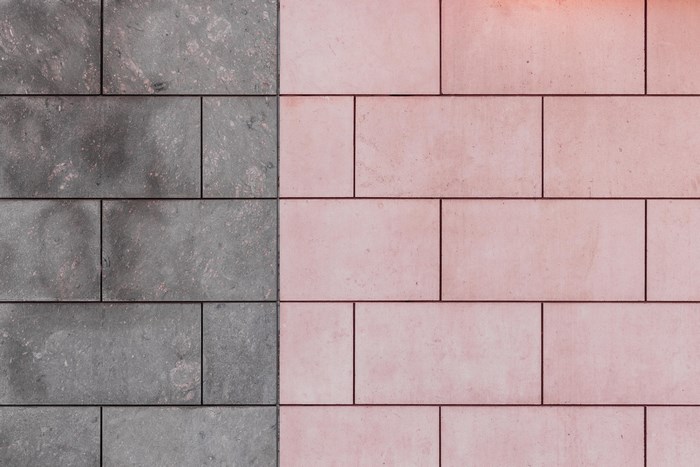 Grey and pink stone tiles wall pattern