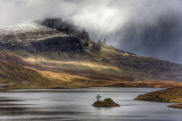Misty Scottish Highlands Lake with Snowy Mountain