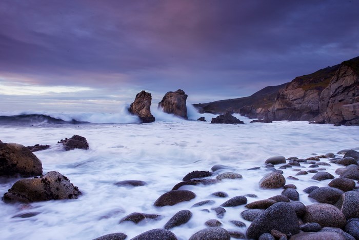 Long exposure of waves crashing on rocks at Highway 1 coast