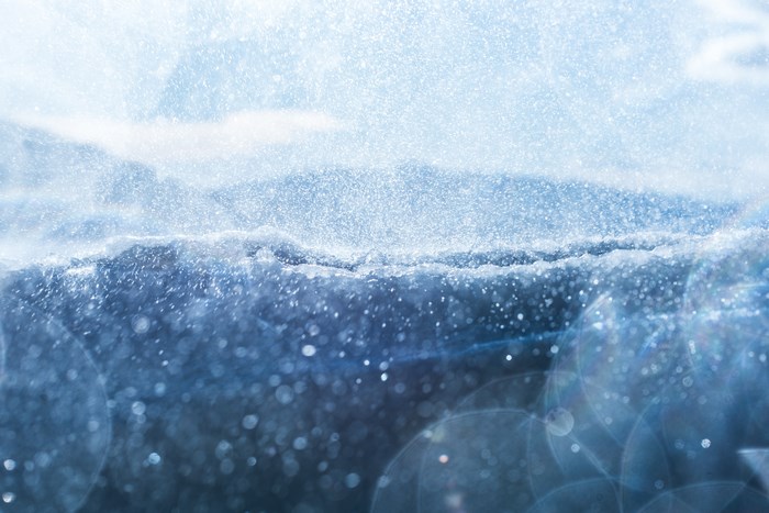 Close-up of ice and snow with bokeh and lens flare