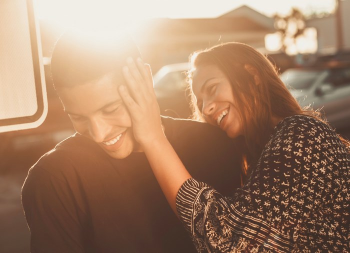 Couple laughing during golden hour