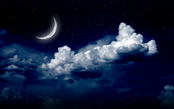 Crescent moon and stars in the night sky