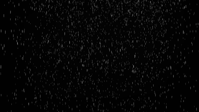 Rain falling on a black background