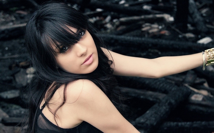 Young woman with dark hair and bracelets