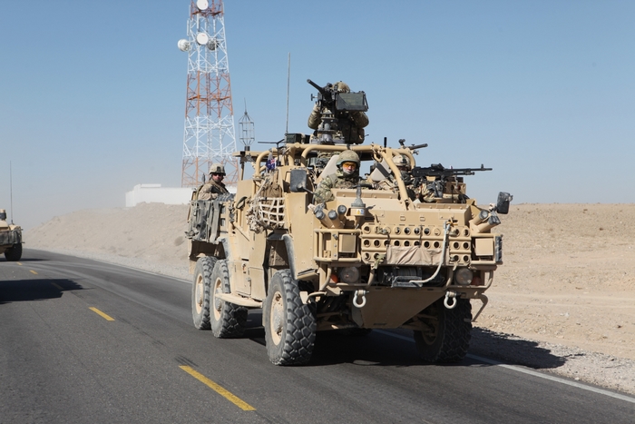 US Army convoy with military vehicles and soldiers