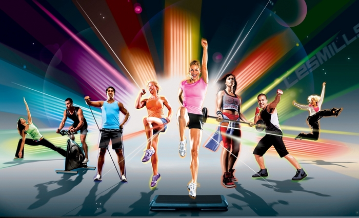 Les Mills fitness group exercising with weights and equipment