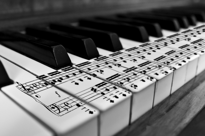 Piano keys with sheet music