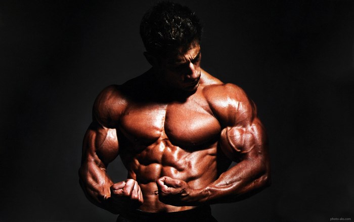 Bodybuilder flexing muscles