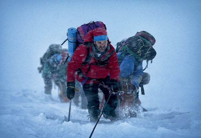 Mountaineers climbing Mount Everest in a snowstorm