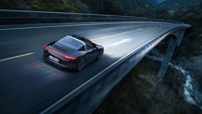 Porsche 911 Targa driving on a bridge