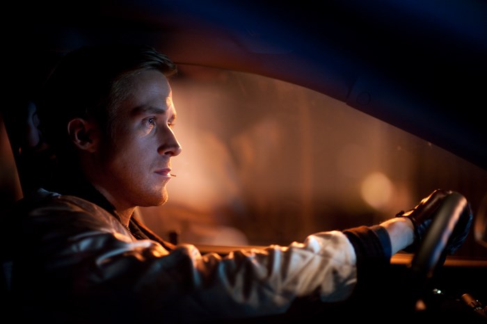 Ryan Gosling driving a car at night