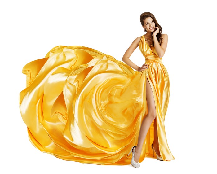 Elegant Woman in Flowing Yellow Satin Dress