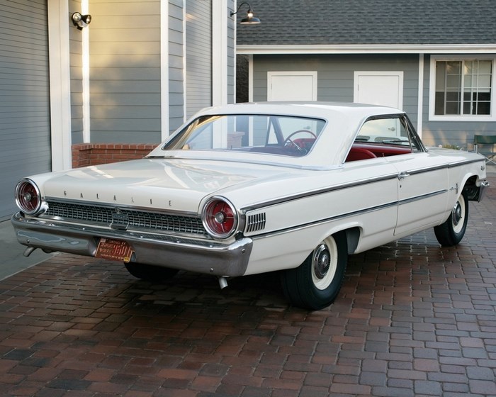 White 1963 Ford Galaxie 500 parked on brick driveway