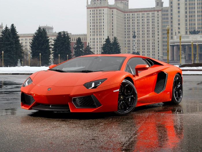 Orange Lamborghini Aventador on Wet Pavement