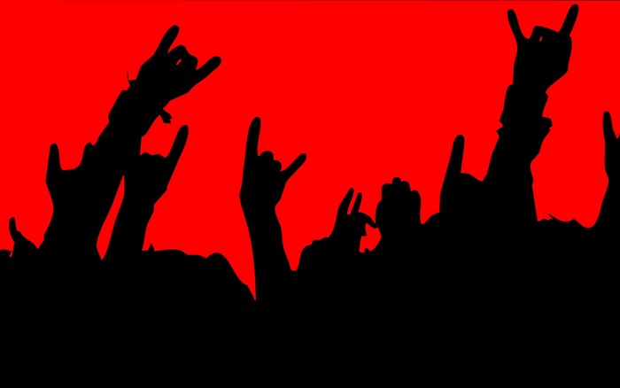Crowd with hands raised at a concert