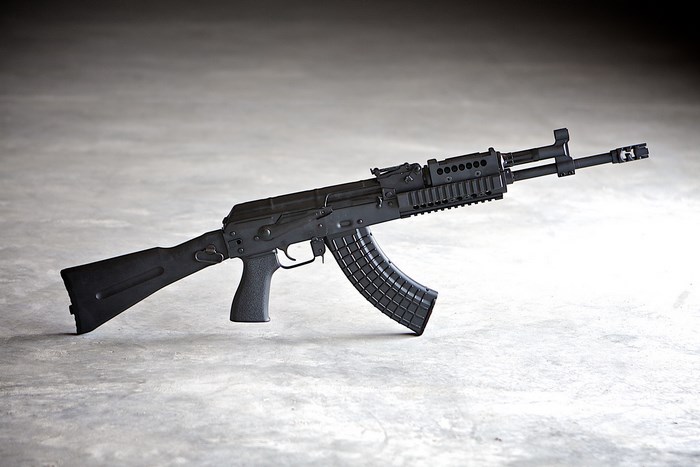 AK-47 rifle on concrete surface