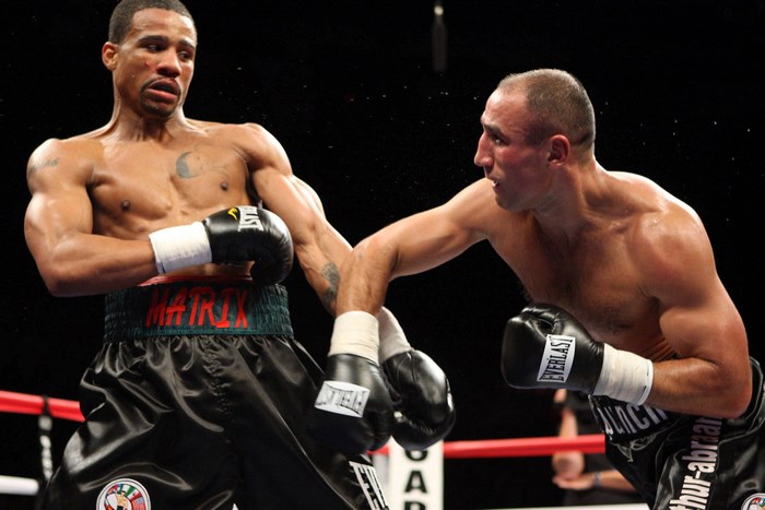 Two boxers in a ring during a match