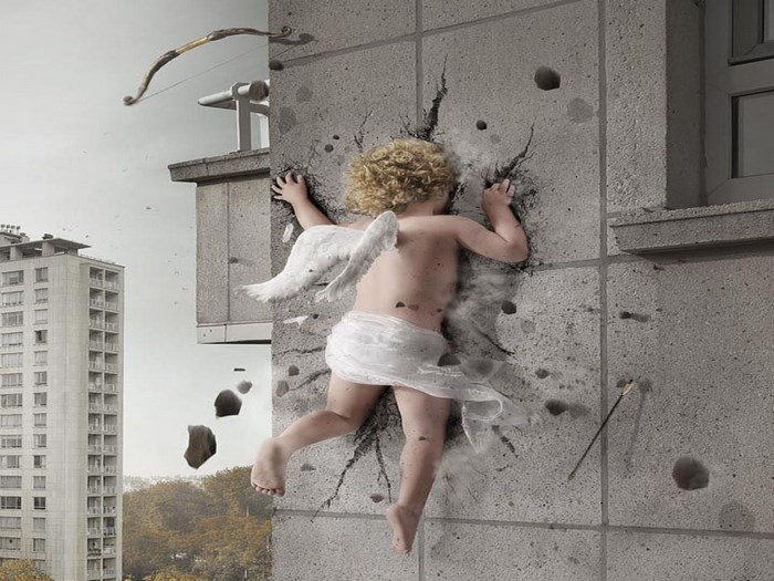 Cupid falling through a concrete wall