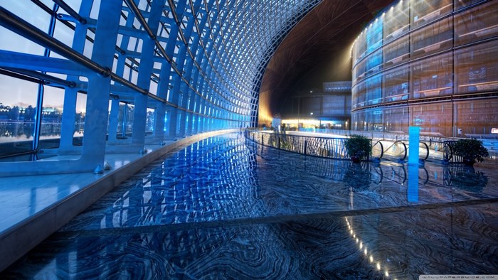 Modern architecture with glass facade and reflective floor