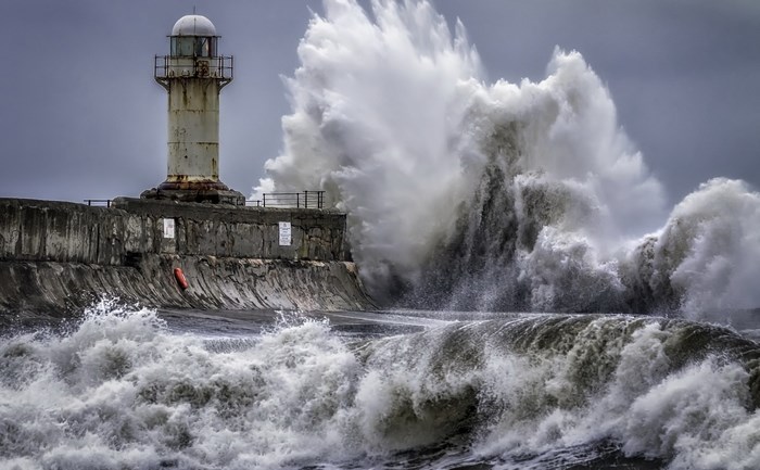 Stormy Sea with Towering Waves Crashing on Lighthouse
